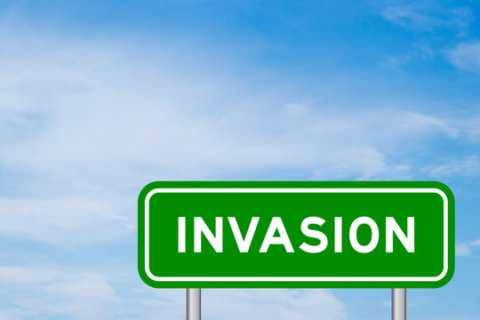 Green color transportation sign with word invasion on blue sky with white cloud background