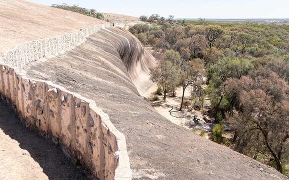 Wall above Wave Rock to funnel rain water into a drinking water storage dam on the Hayden Rock Walk in Western Australia, Australia