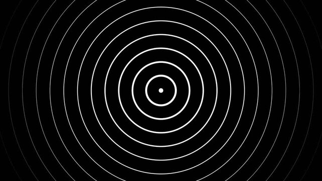 Abstract concentric circles closing into black matte background