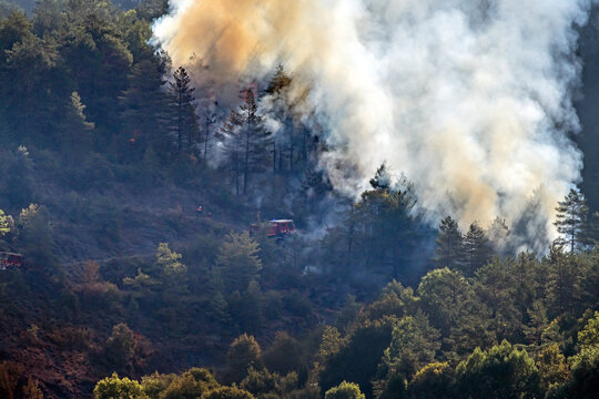 Starting forest fire very near the village of Axat, in the French Pyrenees (Aude department); a fire truck is near the fire