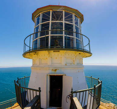 Historic Pt. Reyes Lighthouse Tower and Fresnel Lens High Above The Pacific Ocean, Pt. Reyes National Seashore, California, USA
