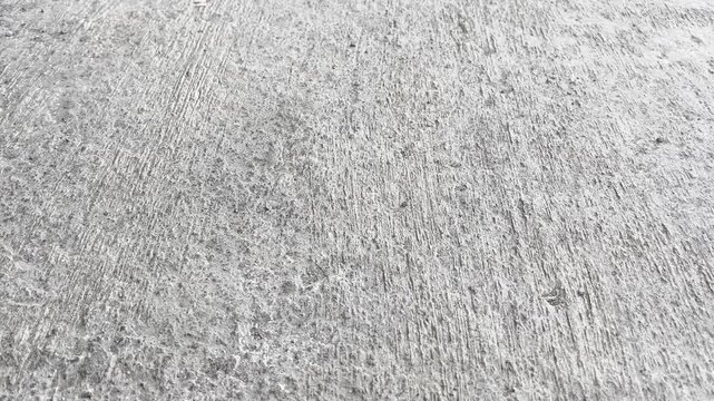 Rough concrete road surface texture with gritty sand particles