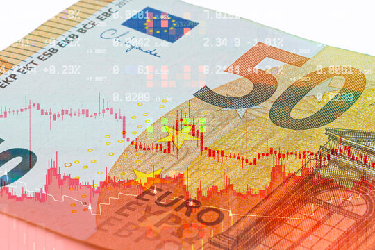 50 euro banknote macro shot with red stock market trading graph double exposure. European financial crisis, euro inflation rate, stock market drop and economic recession concept.