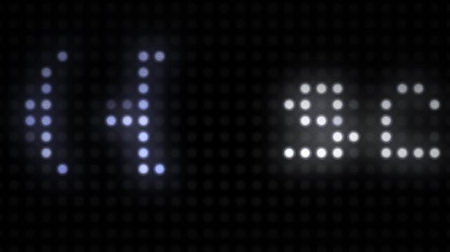 Computer programming source code and variables displayed on a digital LED pixel screen.