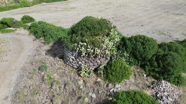 Ancient Nuragic Stone Tower and Archaeological Ruins at San Giovanni Nuraghe in Siamanna