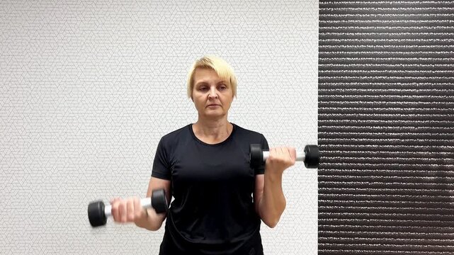 A person lifts dumbbells for workout sessions