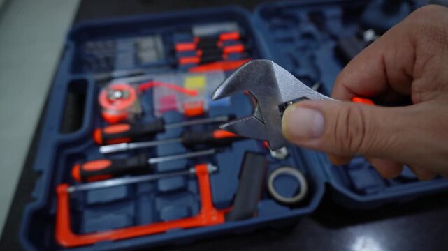 adjustable, wrench, spanner, adjustable wrench, adjustable spanner, hand, work, man, technician, tool, case, equipment, worker, close-up, repair, construction, engineering, industry, maintenance, hand