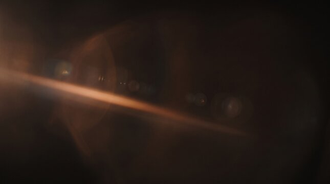 Copper Lens Flare with Diagonal Cinematic Light Streaks