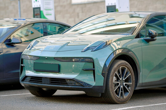 Minsk, Belarus. May 15, 2024. Zeekr X green EV crossover parked in city parking area with charging infrastructure in background. Electric vehicle, eco friendly transport and automotive engineering