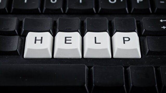 Computer keyboard keys spelling the word help