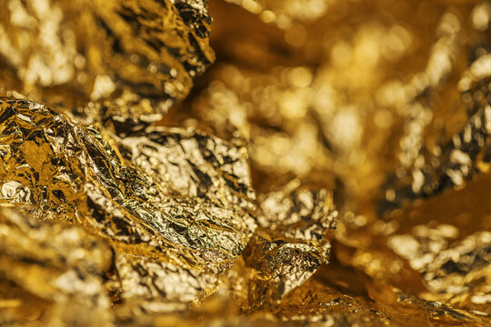 Bright gold foil texture, crumpled metal background