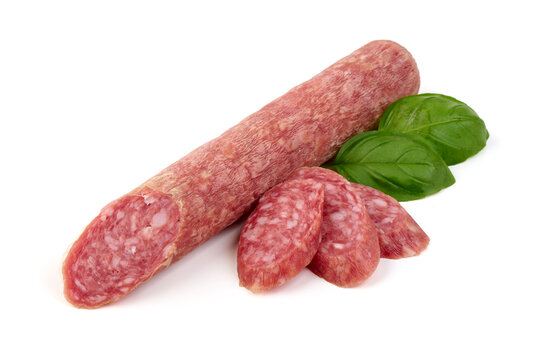 Delicious sliced salami sausage with basil leaves