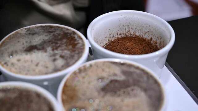 Barista preparing coffee cupping tasting session