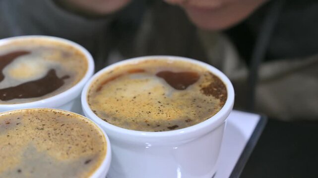Barista cupping coffee during a professional tasting session