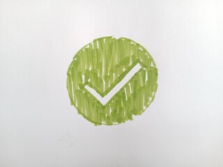 Hand-Drawn Green Check Mark Icon in Circle on White Background. Handwritten Green Tick Symbol inside Circle - Approval, Quality Control, Correct Choice and Success Concept. © Fitria