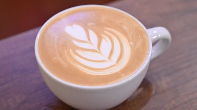 White cup of cappuccino with latte art
