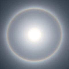 Naklejka premium Sun halo atmospheric phenomenon, circular rainbow around the sun in the sky, meteorological event and optical illusion in nature