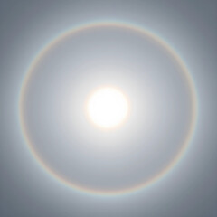 Naklejka premium Sun halo atmospheric phenomenon, circular rainbow around the sun in the sky, meteorological event, optical illusion, light refraction in clouds