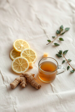 Healthy immune boosting concept with ginger lemon tea, honey and mint leaves for winter wellness remedies
