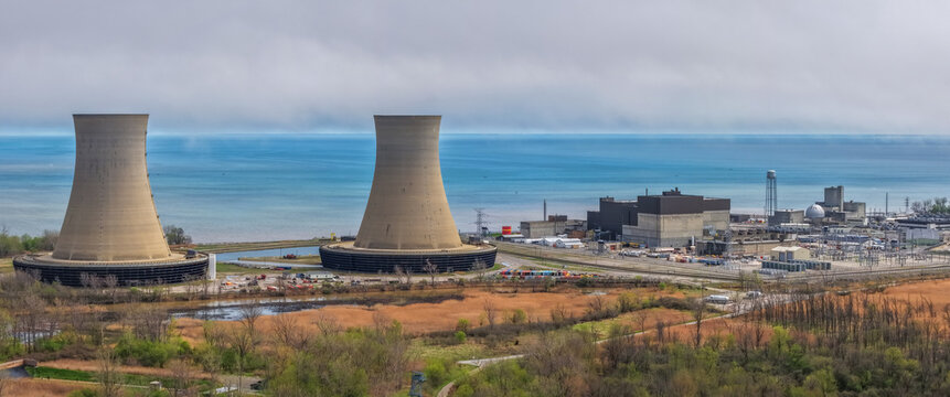 Aerial view of the Nuclear Power Plant with its two large cooling towers situated along the shore of Lake Erie in Monroe, Michigan, United States.