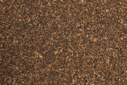 Dark brown cork background. Textured cork board background. Natural cork texture. Top view background