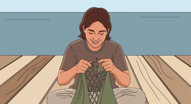 Person sitting on a dock, mending a net