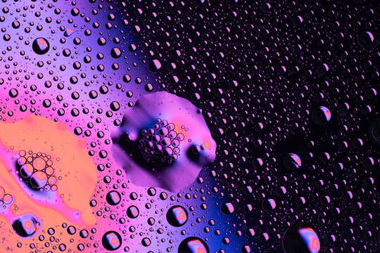 Oil and water creating abstract colorful bubbles background