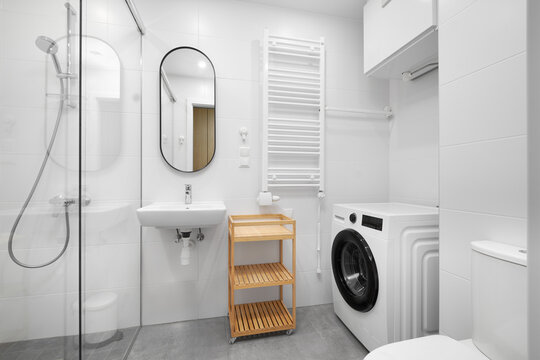 Modern bathroom interior mockup with washing machine, shower cabin, and sink.