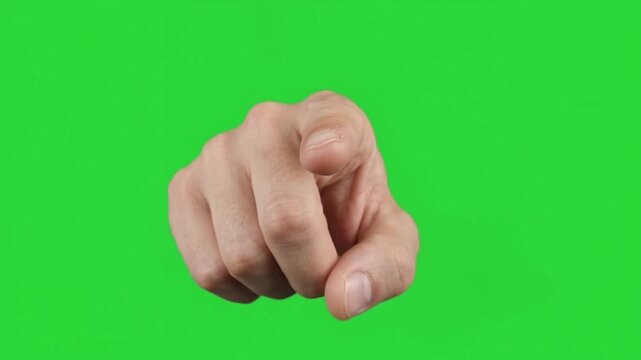 Confident male hand pointing index finger forward to touch press tap push digital screen on chroma key green background studio