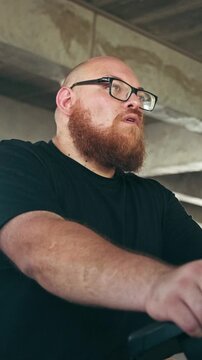 Focused Bearded Man Wearing Glasses Working Indoors