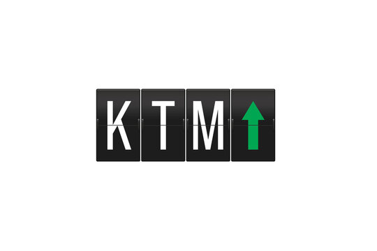 KTM code appearing on a classic split-flap display, often seen at transportation hubs, showing a green arrow indicating direction or departure on a transparent background