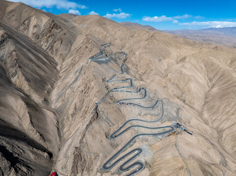 panlong ancient road winding mountain highway in xinjiang desert landscape