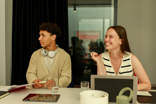 Two People Discussing Ideas in a Modern Office