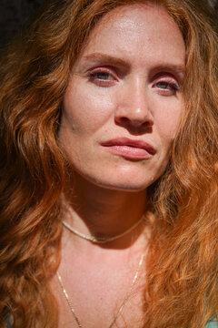 Serene portrait of a glowing redhead