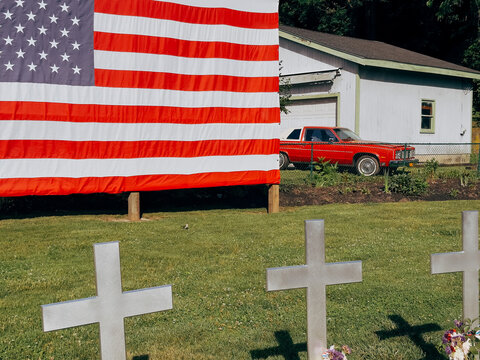 American Flag and Memorial Crosses in Small Town New York