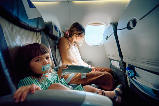 Mother and Daughter together Flight Airplane
