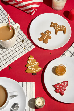Christmas Table With Gingerbread Cookies, Warm Drink and Holiday Decor