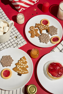 Christmas Table With Gingerbread Cookies, Coffee, Gifts and Candles