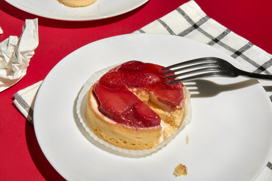 Partly Eaten Tasty Strawberry Tart With Fork On A Festive Dining Table