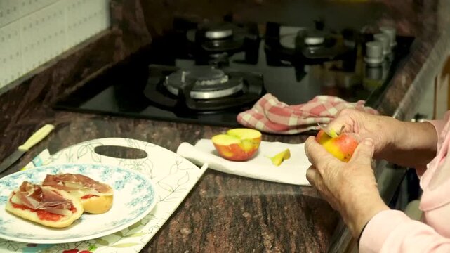 Older woman preparing dinner at home, real domestic lifestyle.
