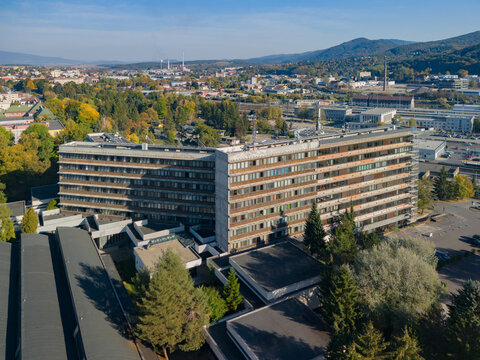 Aerial view of the Faculty of Technology at the Technical University in Zvolen, featuring a large modernist building complex surrounded by trees in Zvolen, Banskobystricky kraj, Slovakia.