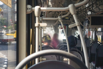 Inside a TransJakarta bus in Jakarta, Indonesia, showcasing the city’s public transportation system and everyday urban commuting © krisbiantography