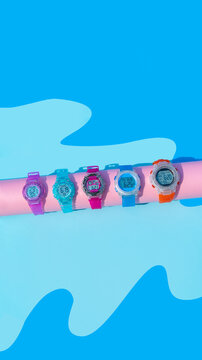Digital watches on water wave paper background studio shot with copy space