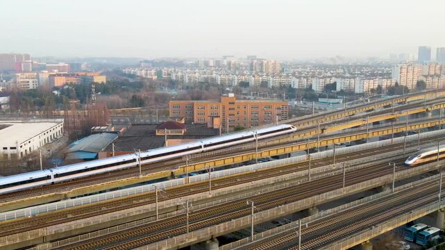 High-Speed Train Crossing Elevated Railway Bridge in Modern City