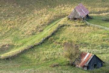 old wooden shepherd huts in a Pieniny meadow © lumofoto