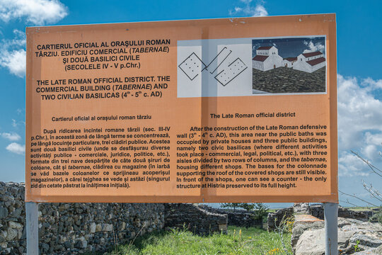 HISTRIA, ROMANIA - JULY 19, 2020: Information panel at the Histria archaeological site describing the Official Quarter of the Late Roman city, including civil basilicas and tabernae.