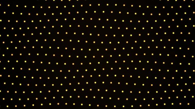 Golden glowing dots on a dark background forming a seamless looping pattern