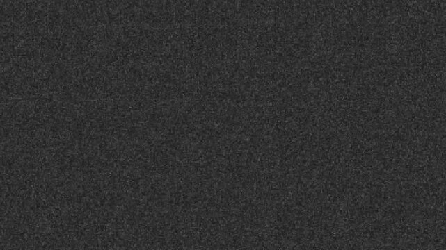 Realistic, subtle gray film grain texture. Seamless loop for adding a cinematic, vintage, or analog look to footage. Use with overlay or soft light blend modes for authentic effect. 4K video