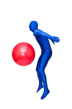 Mysterious blue man in blue suit exercise with pilates  ball