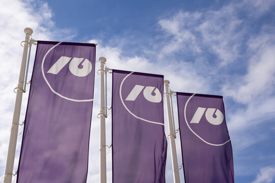 Ljubljana, Slovenia - 21 September 2026: Flags with the NLB logo are displayed in Ljubljana under a blue sky.